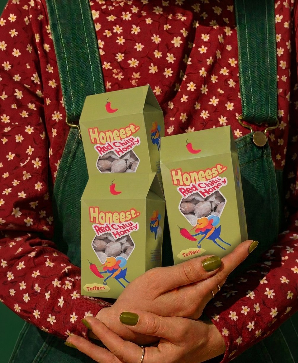 Hands holding two packaging boxes